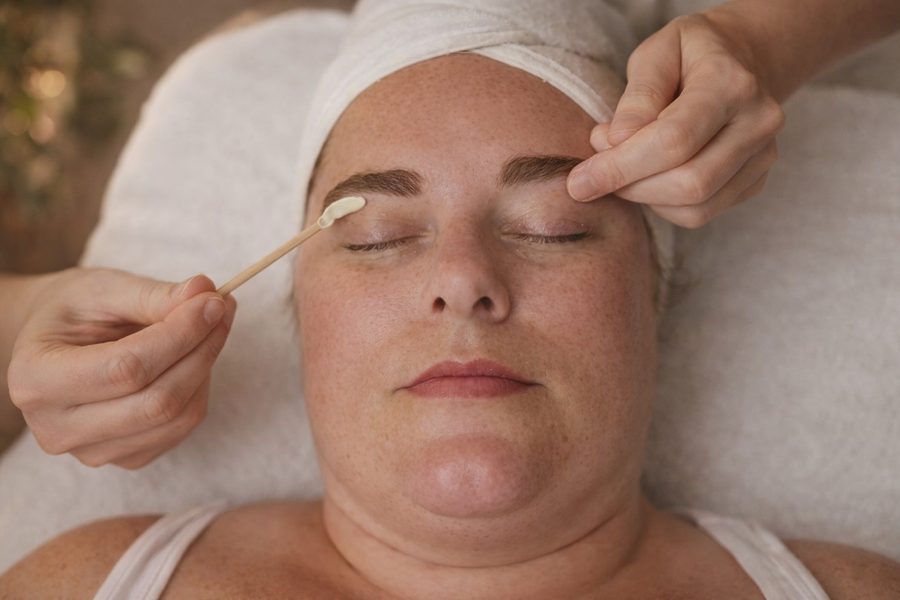 Facial waxing brow cleanup service with applicator and cotton swab at Awaken Zen Spa in Mesa, AZ